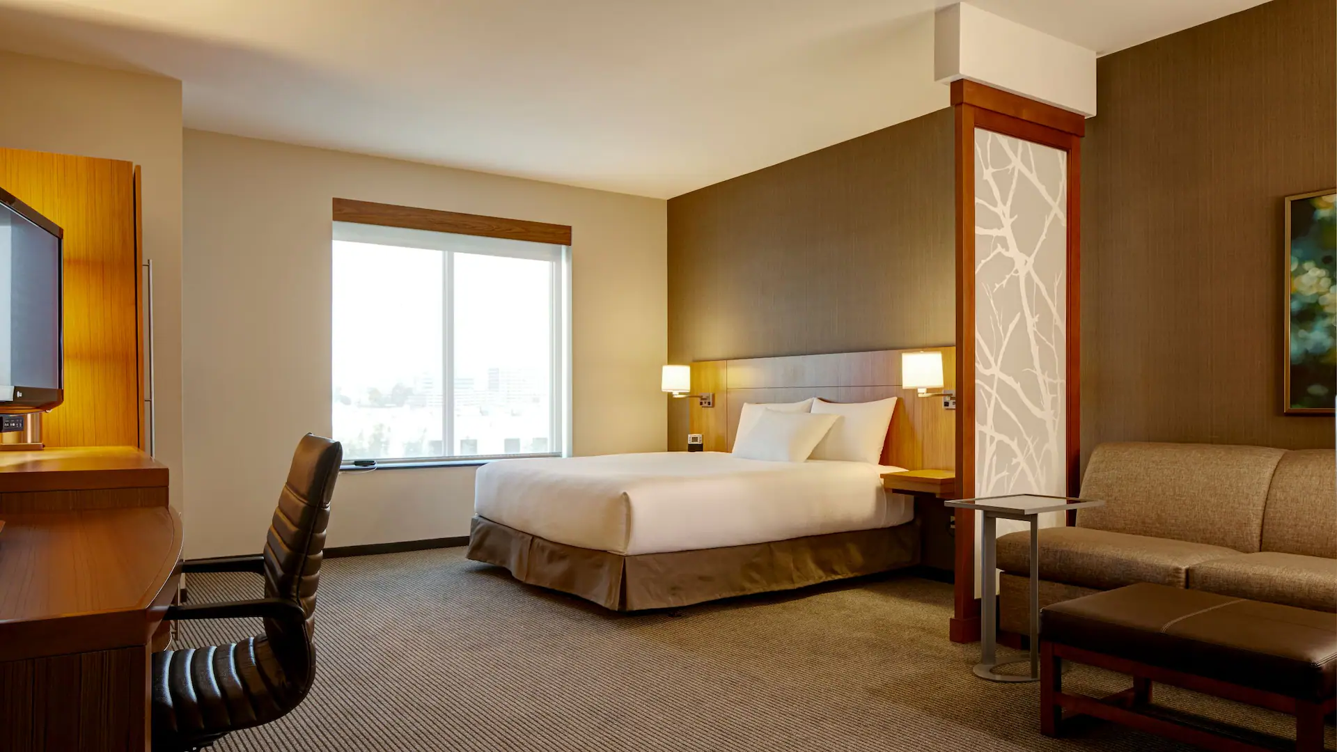 Modern hotel room with king-size bed at Hyatt Place West Des Moines